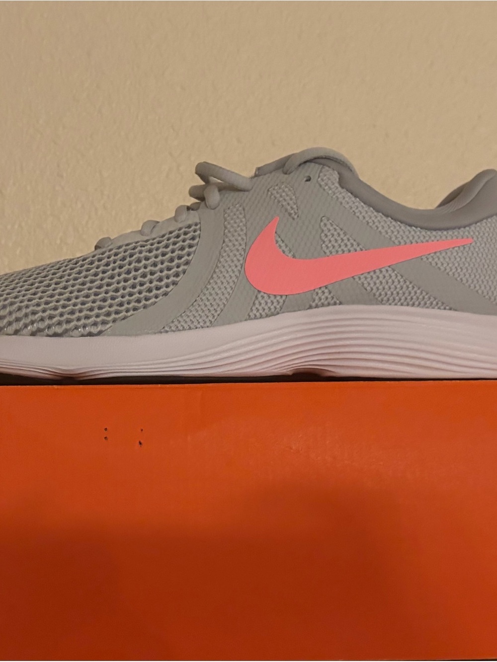 Nike Women's Light Gray Running Sneakers with Pink Swoosh